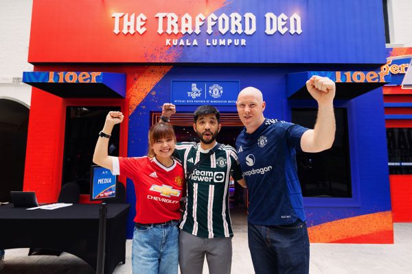 Fans gather at the Trafford Den, the world's first Manchester United pop-up bar by Tiger Beer.