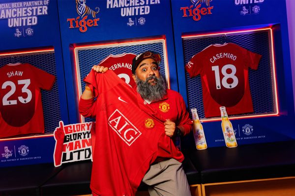 Everyone gets a shot at the Tiger Beer x Manchester United locker-room photo booth.