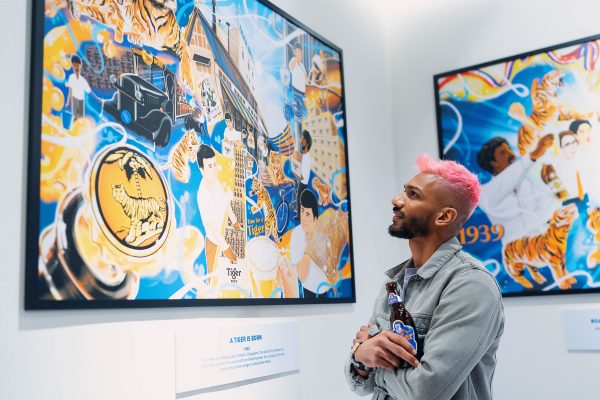 An influencer musing over local artist's interpretation of Tiger Beer milestones.