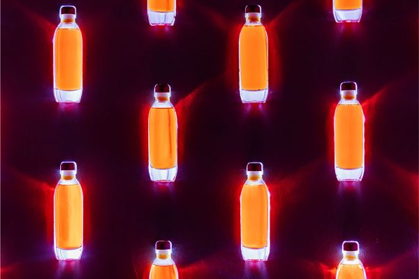 Spellbinding light and liquid installation utilising  tiny bottles of eau-de-vie.