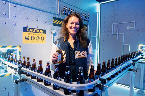 A working Tiger Beer bottle conveyor brings the brewing experience from the virtual to the physical.